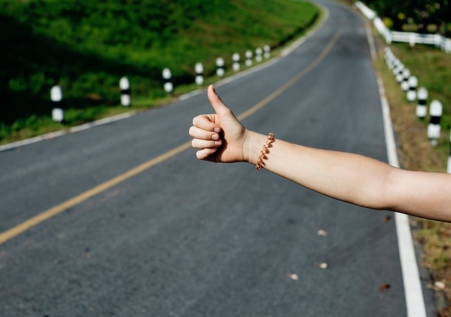 thumb-up hand wave is the most recognized sign for asking for lifts while hitchhiking in Portugal
